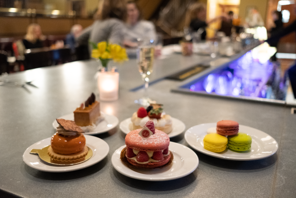 Variety of desserts and pastries displayed on plates at Le Reve in Wauwatosa