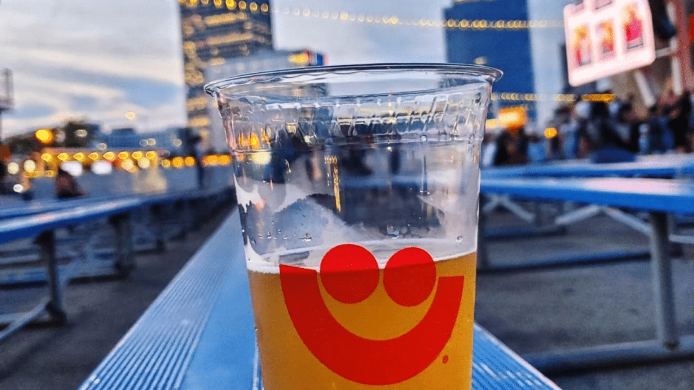 Beer with summerfest logo and Milwaukee buildings in the background